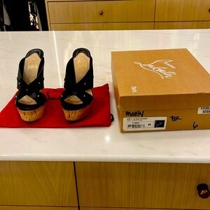 Gorgeous cork Louboutin platforms. Very good condition.